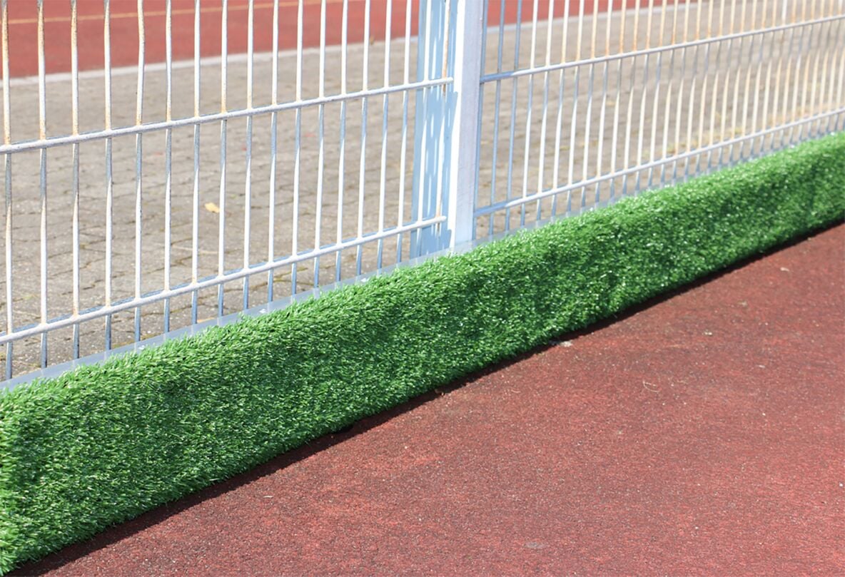 Plastic impact protection board coated with artificial turf