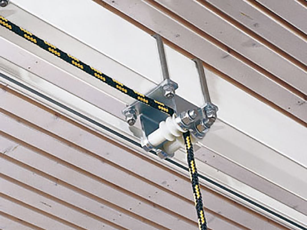 Support bracket for carrier tube