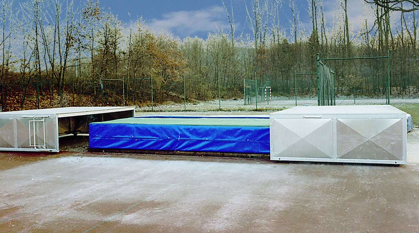 Mobile cover for high jump mats.