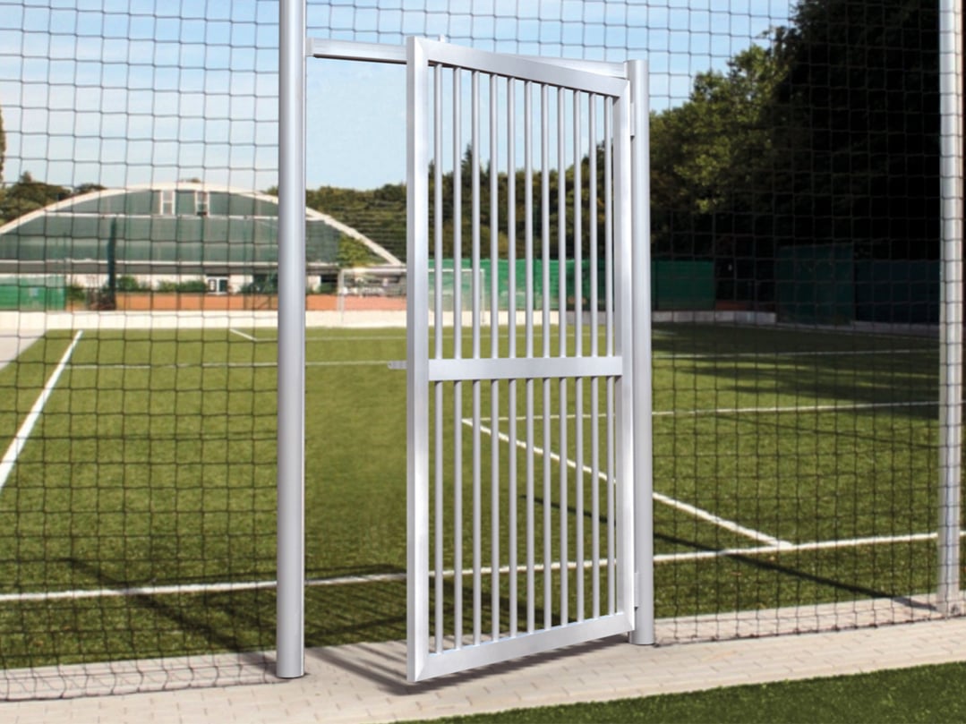 Pass-through door for ball catchers