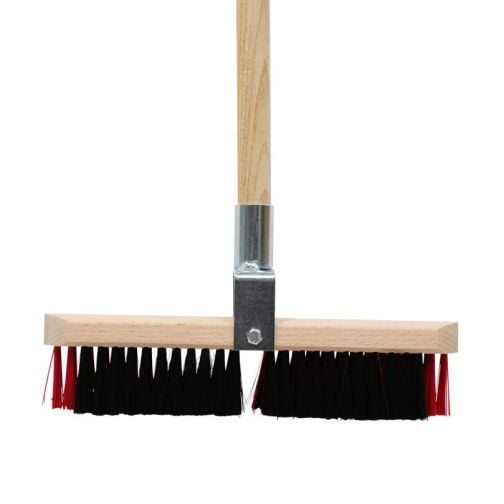 Sweeping brush with dual bristle system