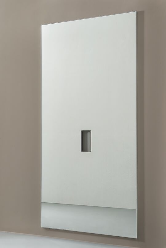 Wall mirror with cutout for ballet bar holder.